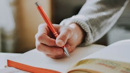 hand writing in a grid notebook hand writing in a grid notebook