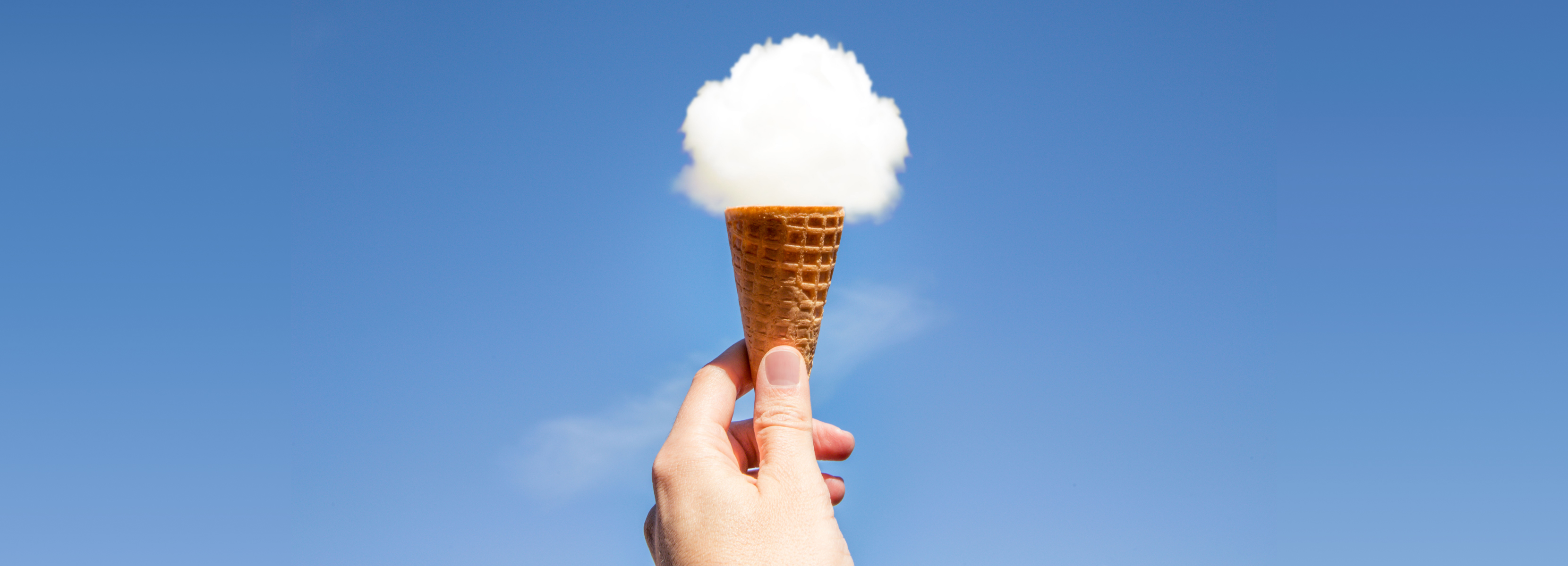Ice cream cone and puff of cloud as ice cream