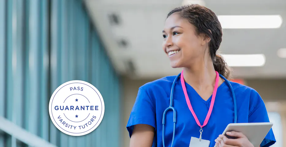 Nurse walking down hallway smiling Nurse walking down hallway smiling