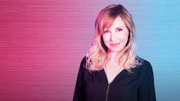 Kari Byron in front of a pink and blue background Kari Byron in front of a pink and blue background