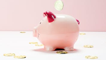 piggy bank with coins around it piggy bank with coins around it