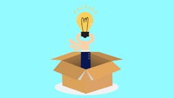 a hand in a box holding a lightbulb a hand in a box holding a lightbulb