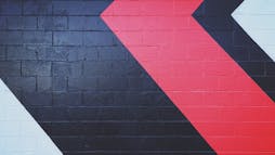a wall with painted black and red diagonals a wall with painted black and red diagonals