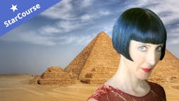 Dr. Colleen Darnell in front of pyramids Dr. Colleen Darnell in front of pyramids