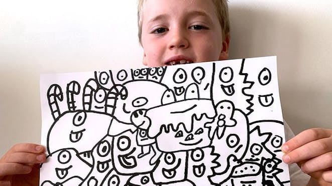 Boy holding doodle