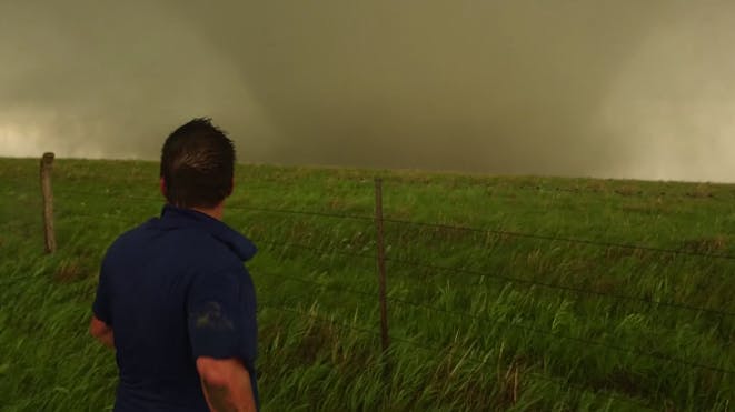 Reed in front of a tornado