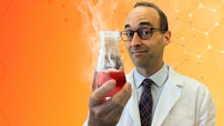 Phil Cook holding a beaker Phil Cook holding a beaker