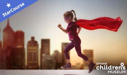 Girl with a superhero cape on running in front of a city Girl with a superhero cape on running in front of a city