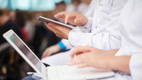 nursing students studying on laptops and tablets nursing students studying on laptops and tablets