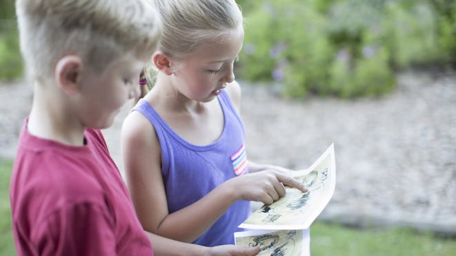 Children reading a map