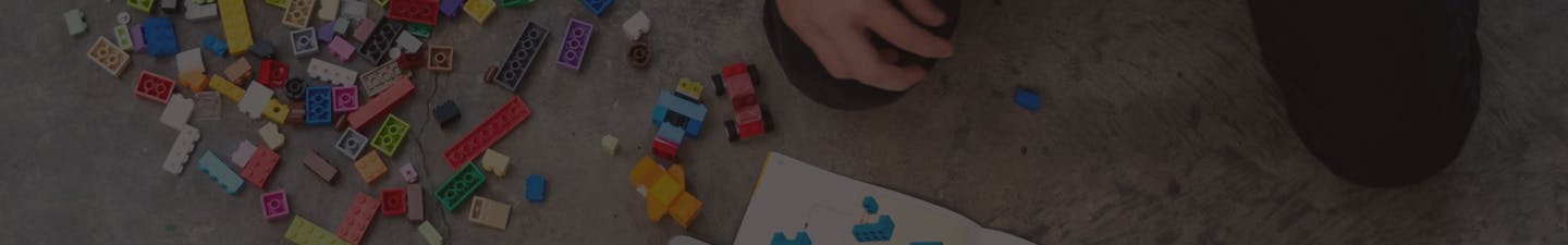 Child playing with lego blocks