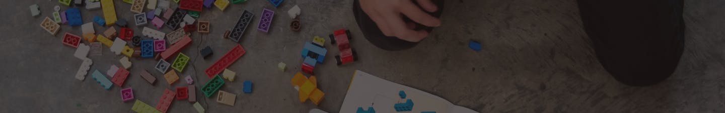 Child playing with lego blocks Child playing with lego blocks