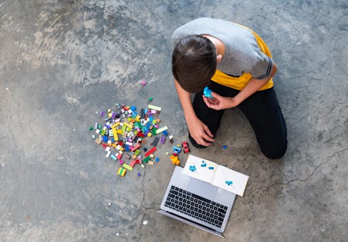 Kid playing with legos Kid playing with legos