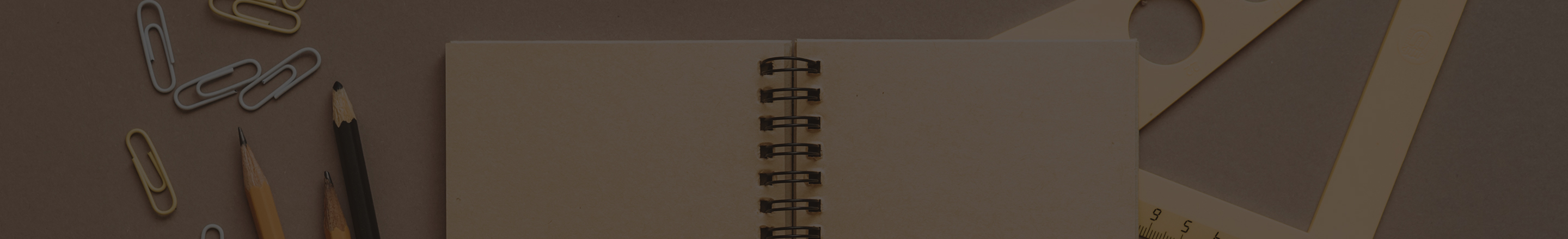 Open book with office supplies