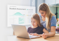 Parent with student looking at laptop