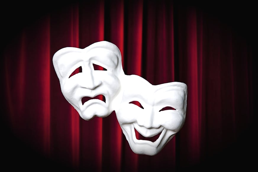 Comedy - tragedy masks in front of a red curtain Comedy - tragedy masks in front of a red curtain